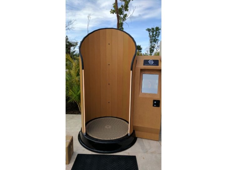 a wooden shower with a screen