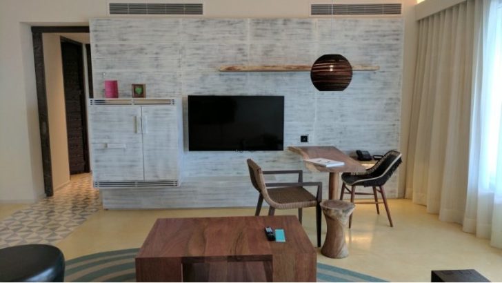 a room with a television and a table