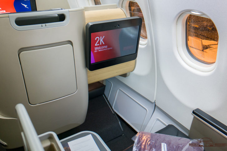 a screen on the side of a plane