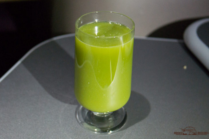 a glass of green liquid