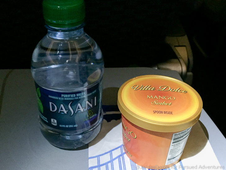 a bottle of water and a container of ice cream
