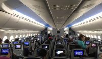 a group of people sitting in an airplane