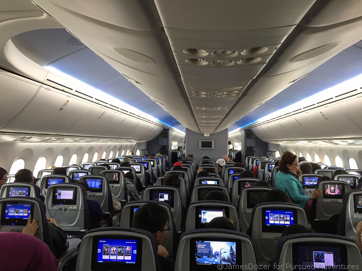 a group of people sitting in an airplane
