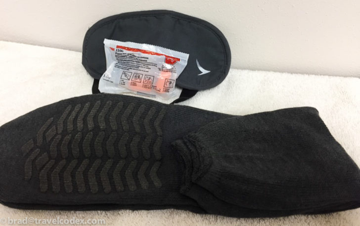 a pair of socks and eye mask