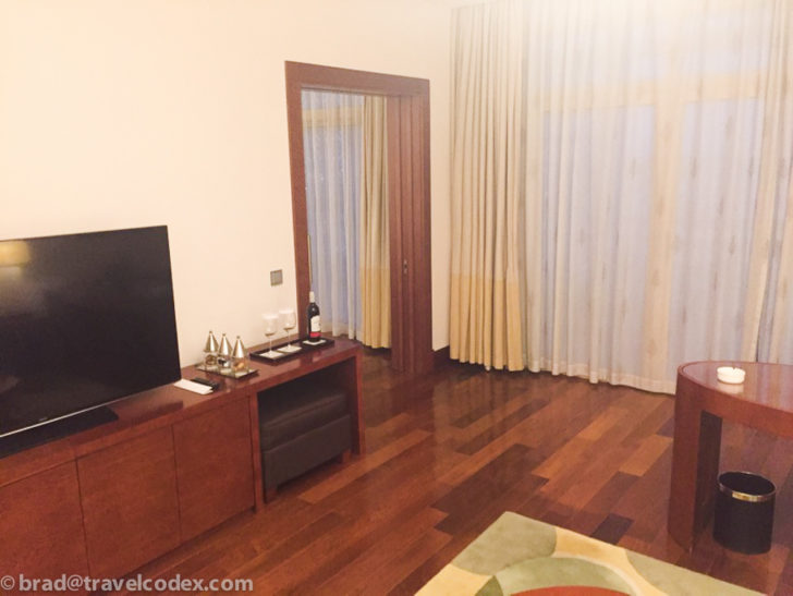 a room with a television and a table