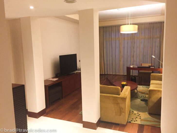 a living room with a television and couches
