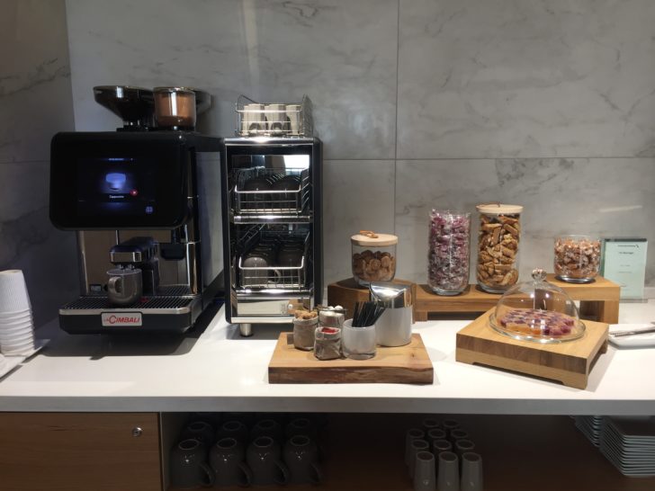 a coffee machine and food on a counter