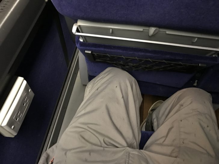 a person's legs in a seat