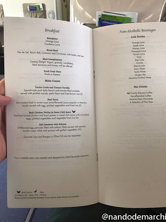a hand holding a menu