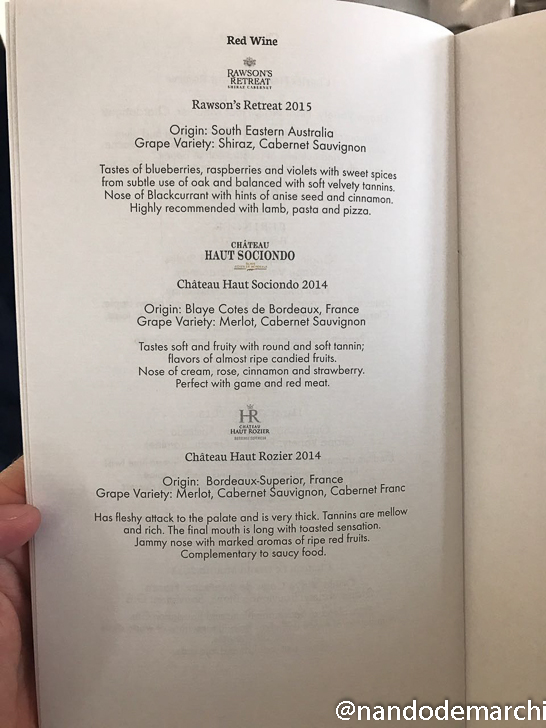 a hand holding a menu