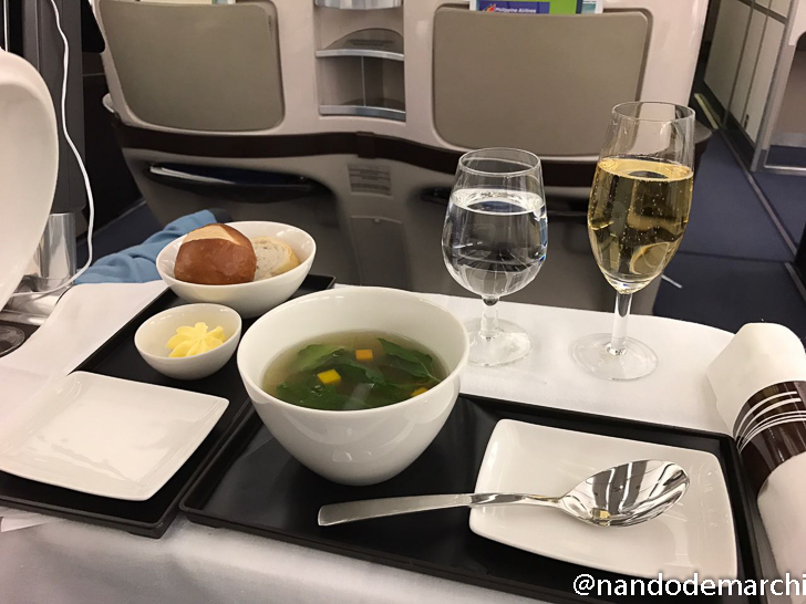 a tray with food and glasses on it