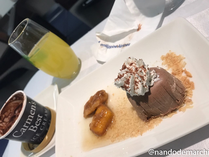 a plate of dessert with a drink and a glass of liquid