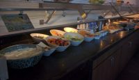 a buffet with different food items on it