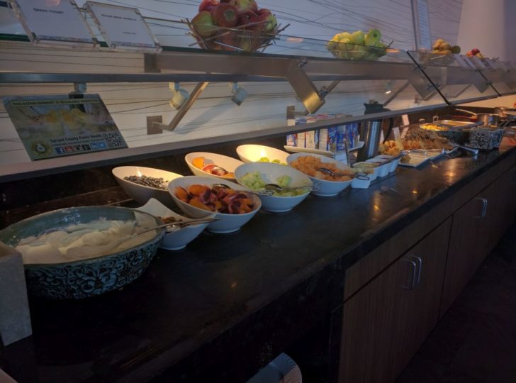 a buffet with different food items on it