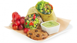 a plate of food with a bowl of dip and a cookie