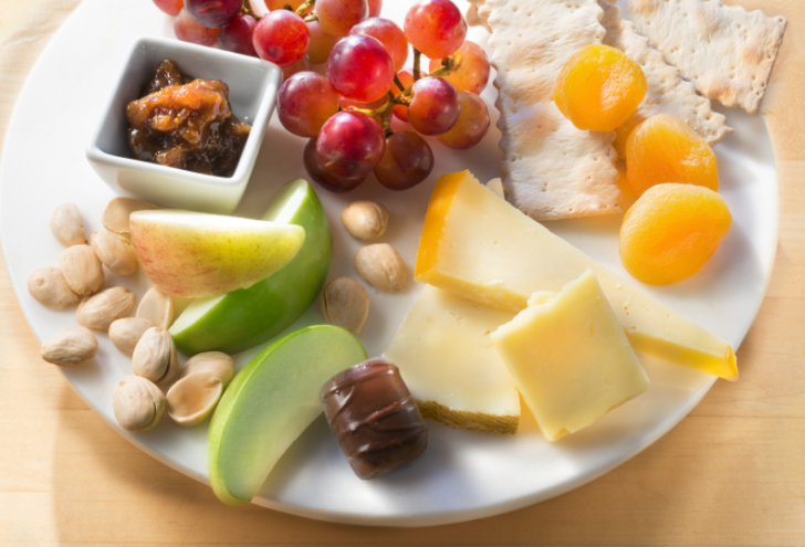 a plate of food with fruit and nuts