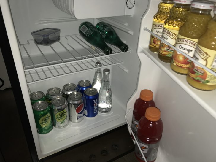 a refrigerator with drinks and beverages