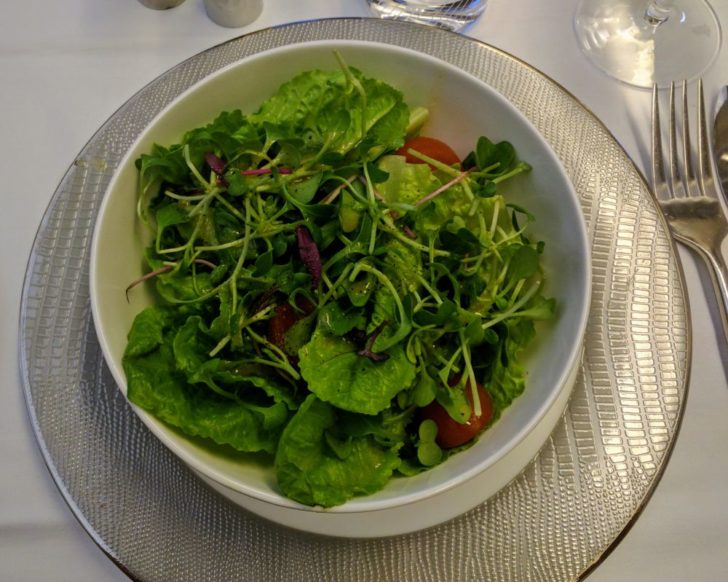 a bowl of salad on a plate