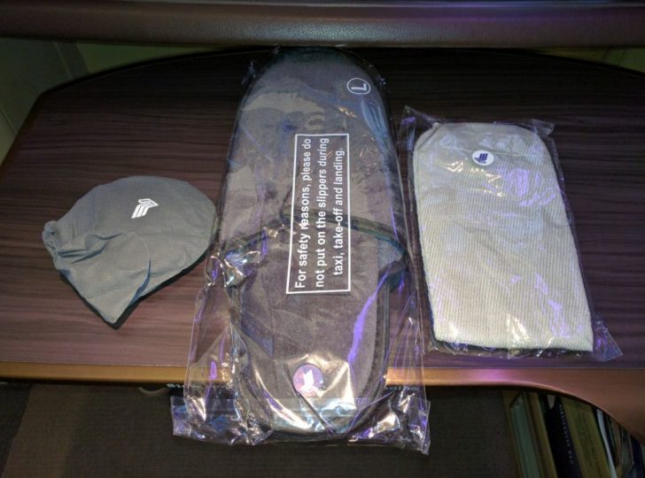 a pair of slippers and a hat on a table