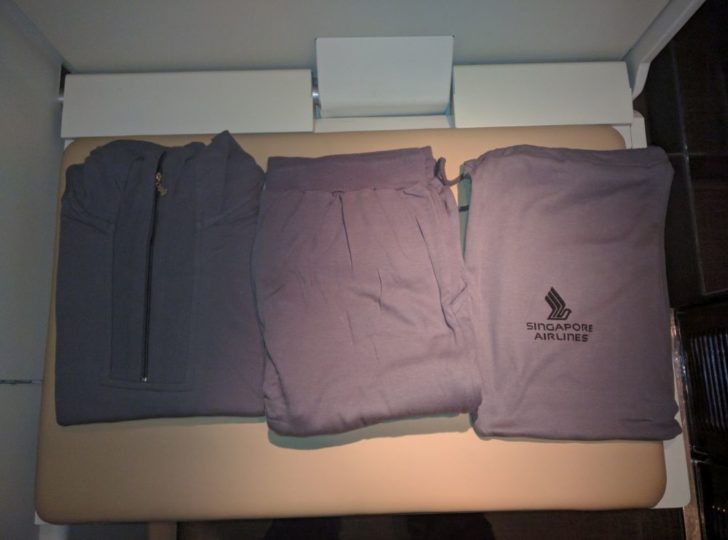 a group of folded clothes on a table