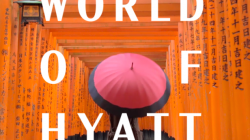 a person holding a red umbrella