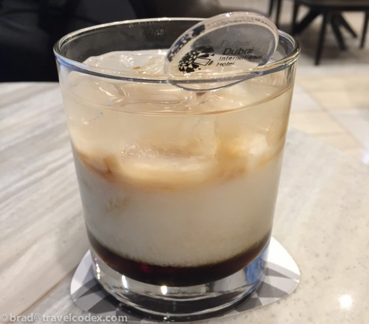 a glass with a spoon in it