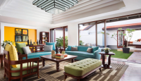 a living room with a blue couch and coffee table
