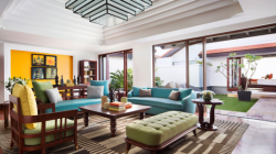 a living room with a blue couch and coffee table