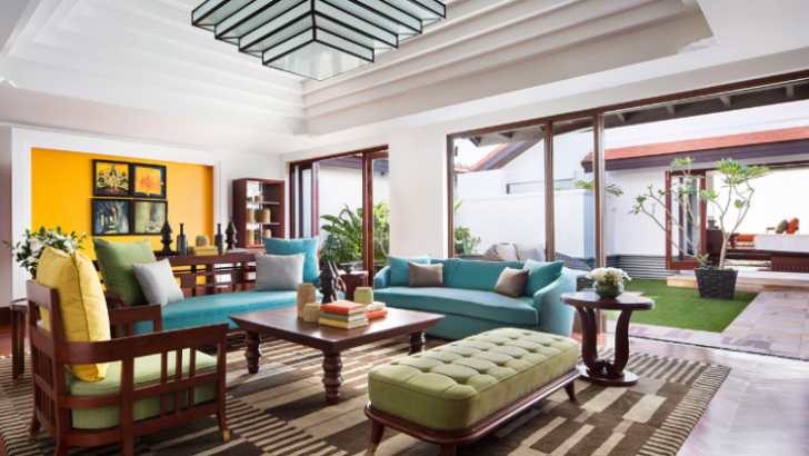 a living room with a blue couch and coffee table