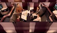 a family sitting at a table in a plane