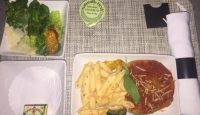 a plate of food on a tray