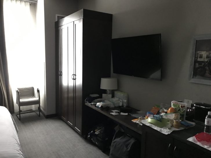 a room with a tv and a cabinet