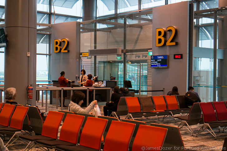people sitting in an airport waiting area