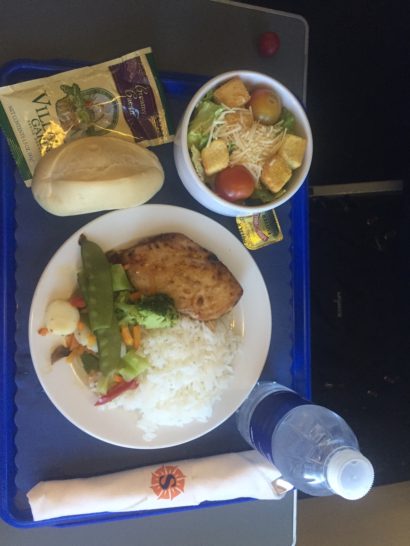 a plate of food and a bottle of water