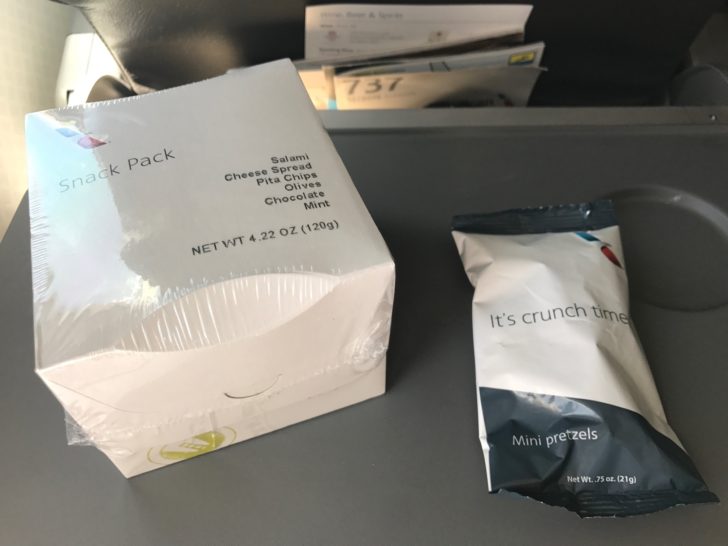 a white box next to a small packet