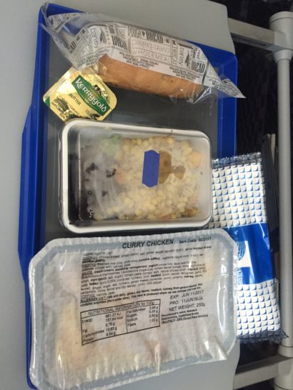 food in a tray on a plane