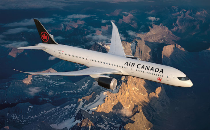 a plane flying over mountains