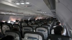 a group of people sitting in an airplane