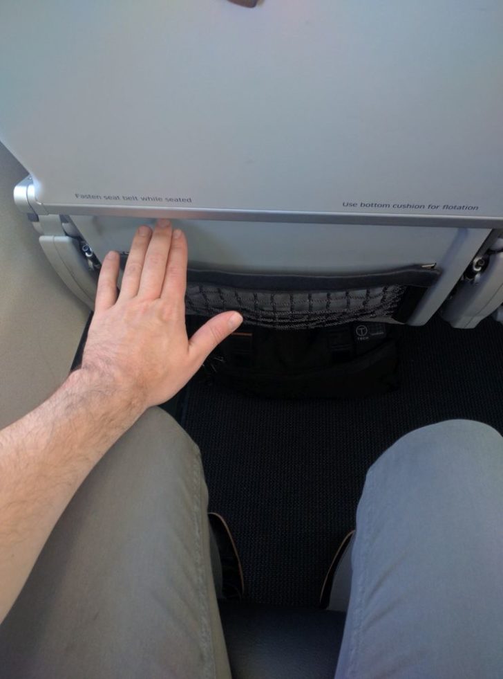 a hand on a seat