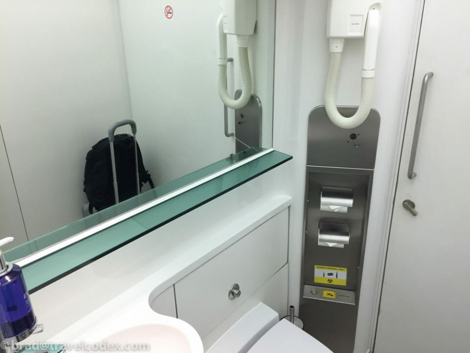 a bathroom with a mirror and a sink