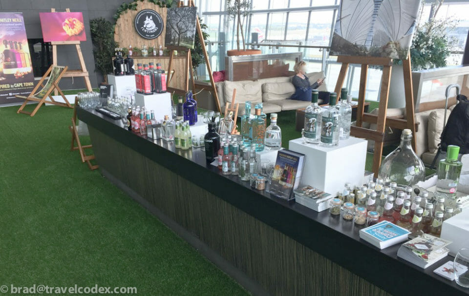 a table with bottles of alcohol and books on it