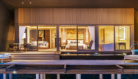 a house with a deck and a dock