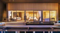 a house with a deck and a dock
