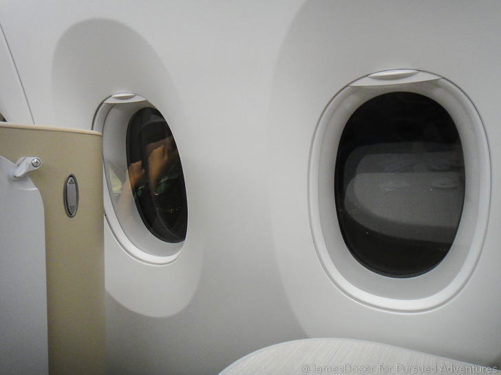a window with a round object in the middle