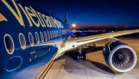 a blue airplane with yellow writing on it