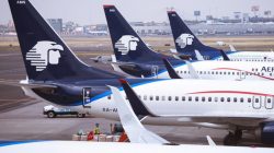 several airplanes parked at an airport
