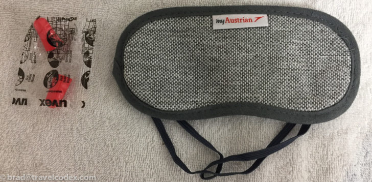 a grey and black eye mask