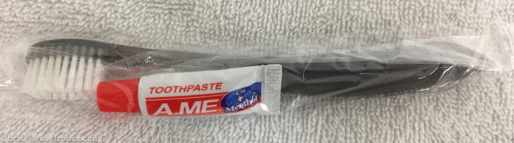 a white and red toothpaste in a plastic bag