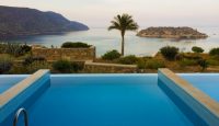 a pool overlooking a body of water
