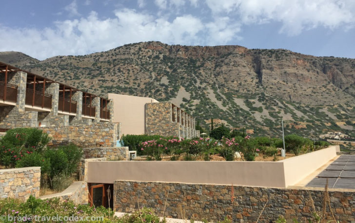 a building with a hill in the background